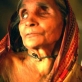 Aisha Begum is 80 years old and a widow. She has still not been able to access a pension. Kate Holt.