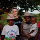 Katy Perry poses for a photograph with women wearing beautiful hats. Kate Holt.