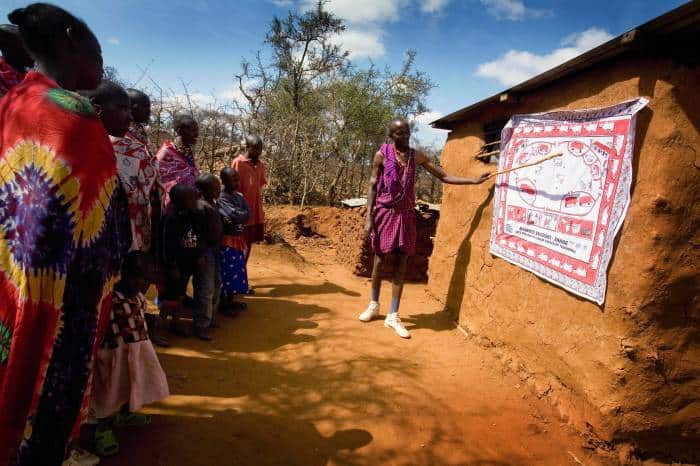 Lester Moitai teaches village women about the SAFE strategy, that helps to prevent trachoma. Kate Holt.