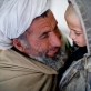A grandfather comforts his grandson who is waiting to see a doctor in the OPD unit of Bost Hospital. Kate Holt.