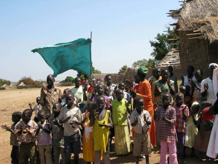 A group of school children stand outside the Chapel in Ngangala village. Kate Holt.