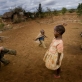 Maua Juma plays with her cousins outside her grandmother's home in the town of Makuyuni. Kate Holt.