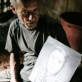 Shadan Chanedaey is 80 years old. His son has thrown him out of his house, and he now lives in a shed. Kate Holt.