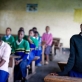 Nastura, who was forced to leave Makuyuni Primary School after her grandmother died, poses for photographs. Kate Holt.