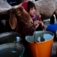 A young girl feeds her goats in the village of Borlak Paein in Bamyan Afghanistan. Kate Holt.