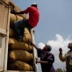 The dried beans are loaded onto a truck before it is taken to the nearby coffee mill to be ground for sale. Kate Holt.