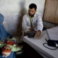 A young boy has his chest examined by a doctor at Woch Tangai Health Centre. Kate Holt.
