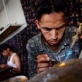 Workers make jewellery in the workshop of Javed Noori in Kabul. Kate Holt.