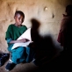 Namuyuni, whose younger sister Leah was not allowed to attend school, poses for photographs. Kate Holt.