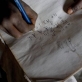 Neema Moshi writes in her exercise book at home during the holidays in the town of Makuyuni. Kate Holt.