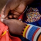 Lasoi Marangwai, 40 years old, and from the village of Koora, makes traditional Maasai Beadwork. Kate Holt.