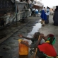 A Somali man and women beg at the port in Bosasso, Northern Somalia