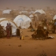 Newly arrived refugees from Somalia stand outside of their temporary homes at Dagehaley camp. Kate Holt.