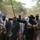 Salva Kiir Mayardit, the Vice President of the Sudan and President of South Sudan leads a crowd of people. Kate Holt.