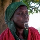 A woman sits smoking a pipe in Custom Market, Juba, Southern Sudan. Kate Holt.