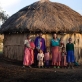 Baby Larumba, who is now attending school regularly, poses for photographs on her homestead. Kate Holt.