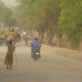 A woman walks down a newly constructed road in Juba, Southern Sudan. Kate Holt.