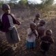 Baby Larumba stands with some of her cousins, and Flora her aunt that cares for her. Kate Holt.