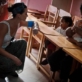 Katy Perry talks to a young girl on a visit to the Ilaiko Child Protection Centre. Kate Holt.