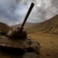 A rusting Russian tank sits ominously under a cloudy sky along the road up the Panjshir Valley. Kate Holt.