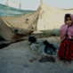 A young girl in a makeshift shelter in one of the many overcrowded refugee camps along Afghanistan's border. Kate Holt.