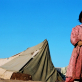 A girl in front of tents in a refugee camp for Afghans in Pakistan. Kate Holt.