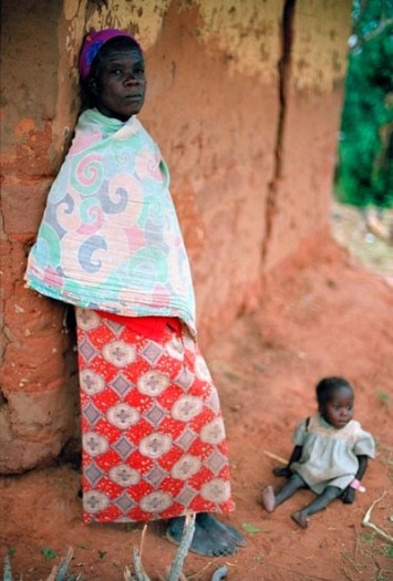 A widow with her young child in a village that has been repeatedly attacked by different armies. Kate Holt.