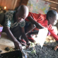 Boys from the Street Children project work on their entry. Kate Holt.