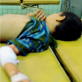 Two young boys lie side by side after being admitted to Nazariyah hospital. Kate Holt.