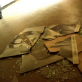 The shattered remains of Saddam Hussein's picture litters the floor of a hospital in Baghdad. Kate Holt.
