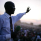 An evangelical Preacher speaks to a crowd of thousands of people in Juba town at sunset. Kate Holt.