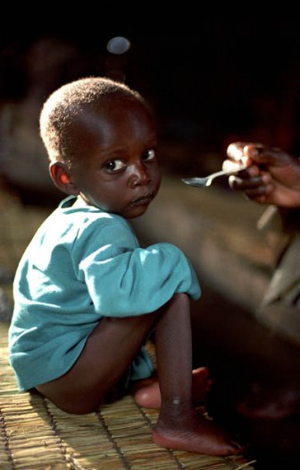 A young boy receives supplementary feeding three times a week at an IRC feeding centre in South Kivu. Kate Holt.