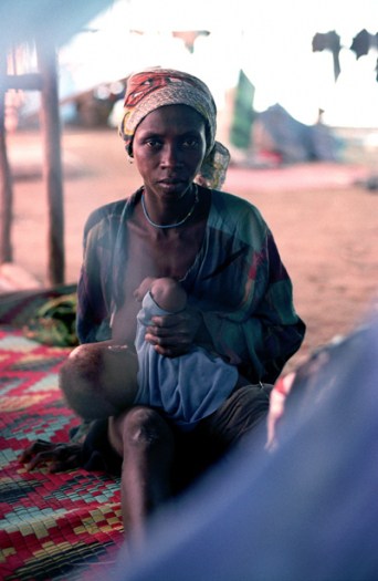 A woman and her child who have been displaced by renewed fighting on the outskirts of Monrovia. Kate Holt.
