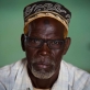 Abdi Saman, A community leader who advocates against FGM, poses for a photograph at a community meeting. Kate Holt.