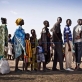 Families who have been displaced by ongoing fighting in South Sudan wait to register to receive a ration card. Kate Holt.