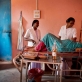 Agatha Kiro, a staff nurse who has undergone MCHIP training, helps a women to deliver a baby. Kate Holt.